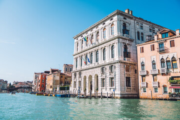 Fototapeta na wymiar Landscape view on European cityscape of ancient district located at Grand Canal in Venice, architecture buildings during summer daytime - perfect place for honeymoon vacations on getaway trip