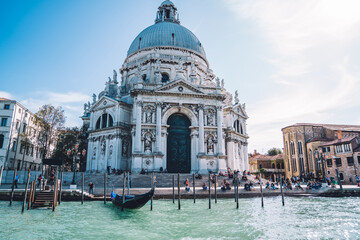 Obraz na płótnie Canvas Picturesque view of ancient architecture building cathedral Santa Maria della Salute in historic center of beautiful Italian city - Venice, scenic Venetian landmark during international vacations