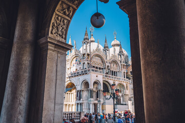 Ancient Basilica San Marco on famous piazza square located in romantic Italian city - Venice -...