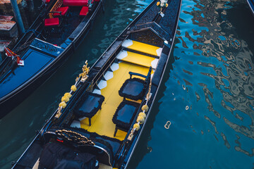 Venetian gondola as taxi transportation for have water sightseeing excursion around cityscape, boat for crossing Grand Canal in Italian lagoon - have romantic trip around famous city Venice © BullRun