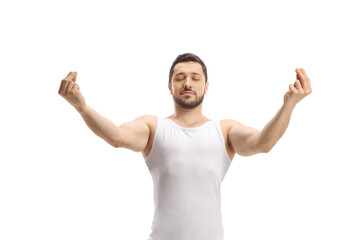 Fototapeta premium Man in a white tank top practicing a yoga pose
