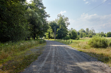A gravel road at rural Europe. Suburban road path