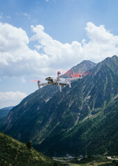 white drone flying in the pyrenees