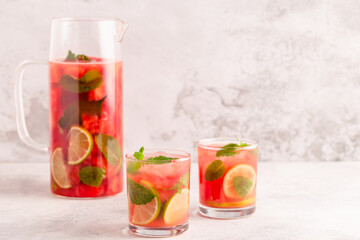 Fresh tasty delicious watermelon lemonade on a light background