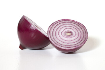 Close up of red or purple onion cut with half slice isolated on white background, clipping path organic onions bulb two piece,