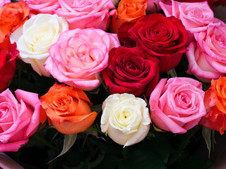 A large beautiful bouquet of multicolored roses