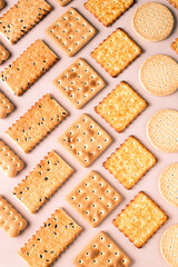 square and round cookies on a pink background
