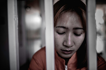 Hands of women desperate to catch the iron prison,prisoner concept,thailand people,Hope to be...