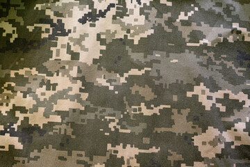 Military camouflage fabric, background texture.
Digital camouflage pattern. Forest camouflage...