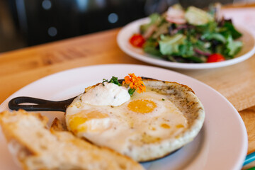 American tomorrow at the cafe. Fried eggs in a frying pan
