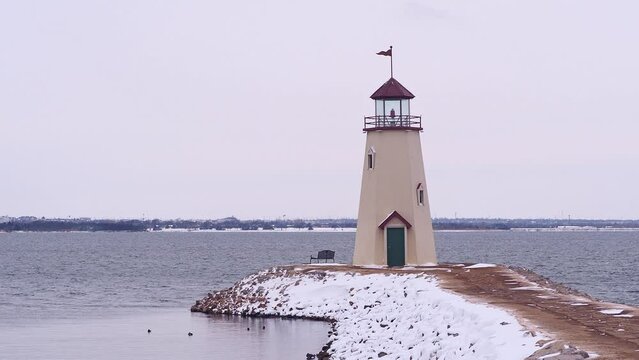 Overcast view of the snowy Lake Hefner lighthouse