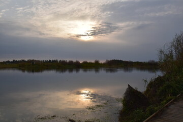 Obraz premium sunset over the river