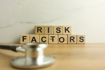 Text risk factors from wooden blocks with stethoscope