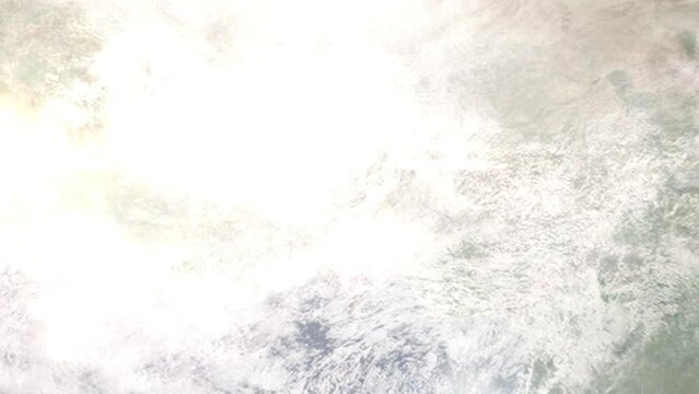 Earth zoom in from outer space to city. Zooming on Parakou, Benin. The animation continues by zoom out through clouds and atmosphere into space. Images from NASA