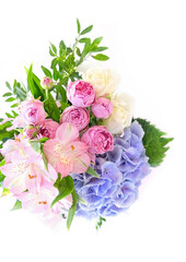 Obraz na płótnie Canvas Gentle beautiful bouquet with Hyacinth, eustoma, pink roses flowers close up on white background. delicate romantic floral festive image