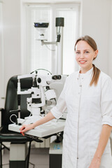 Attractive woman ophthalmologist in ophthalmology clinic. optics salon.