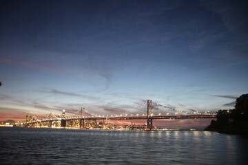 Fototapeta premium San Francisco California travel pictures of the Oakland Bay Bridge at night. 