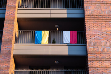 Cracow, Lesser Poland, Poland - 11 March 2022: Polish and Ukrainian flags on the balcony of the...