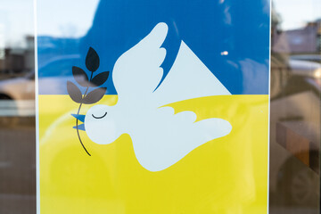 poster with a dove of peace in the colors of the Ukrainian flag