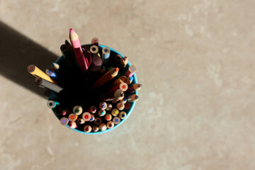 Close up of pencil colours in a cup