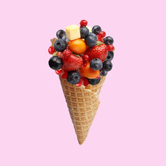 fresh juicy berries in a waffle horn for ice cream. creative concept of healthy eating