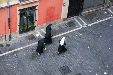 A group of nuns head to mass on Sunday morning after a night out in the Old City. Pamplona
