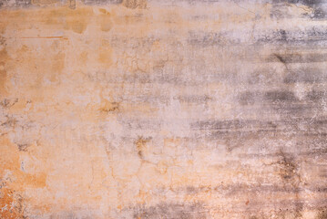 Weathered wall textured background with its color fading 