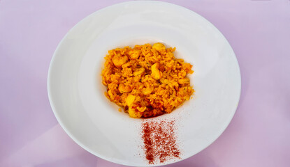 Banda rice paella, rice with prawns and squid and paprika air typical of the Valencian Community