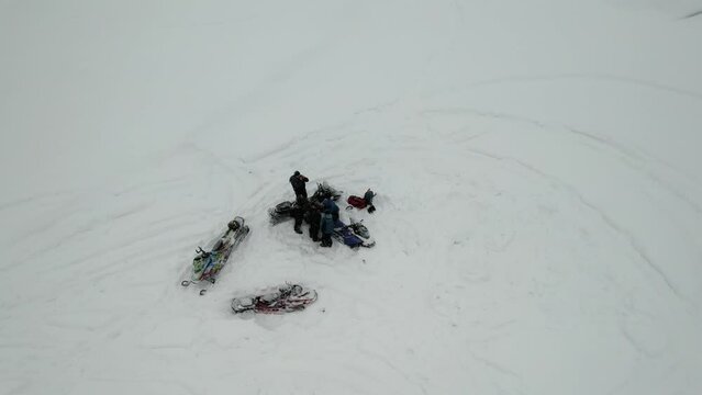 Group of people on snowmobiles