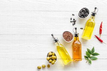 Bottles of different types cooking oil. Sunflower olive and sesame oil