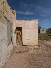 old neon signs, closed abandoned motels, theatre, gas station along Route 66 in Grants New Mexico 