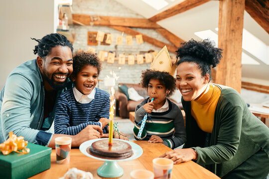 Cheerful African American Family Celebrating Girl's Birthday And Having Fun At Home.