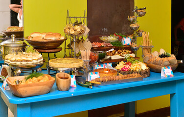 buffet table, savory buffet, Brazilian snacks, turquoise blue wooden table, rustic buffet, birthday table setting, party table setting, table setting, food on the table