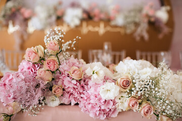 Decoration for a holiday party. Bouquet of fresh flowers on the wedding table