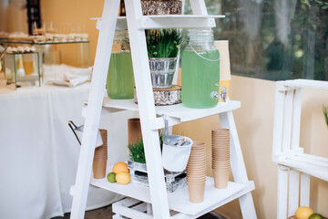 Cold drinks at a wedding party outdoors. Lemonade and Ice Tea servings for guests