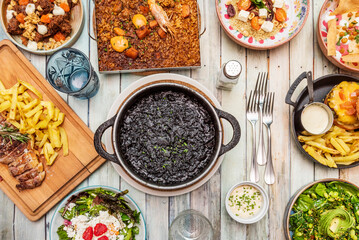 Black rice is a dry rice dish, cooked in paella or in a clay pot, with a characteristic appearance...