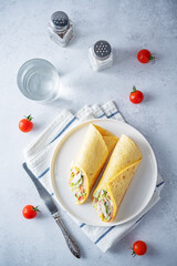 Corn tortilla with chicken and vegetables in a plate