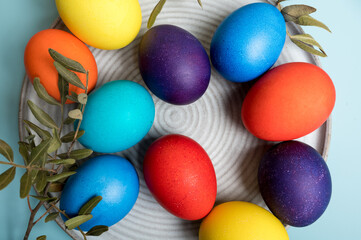 Coloured decorated easter eggs on a blue background