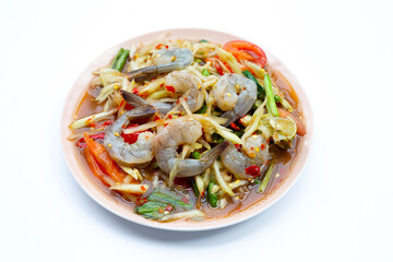 Spicy green papaya salad with shrimp in plate