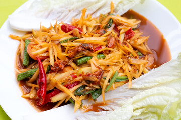 Spicy papaya salad with pickled shells