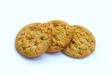 pistachio and almond cookies on white background.