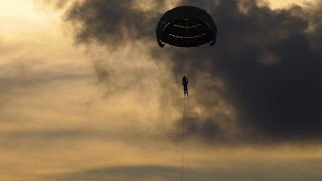 Parachute silhouette in the sky