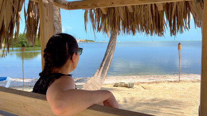 Young woman relaxing at a Caribbean beach - travel photography