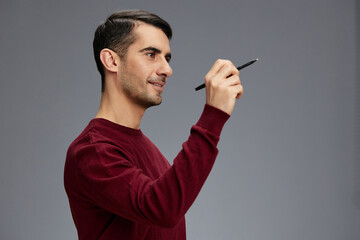 manager in a sweater with pen posing emotions business and office concept