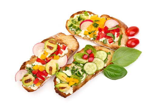 Bruschetta with various toppings, isolated on white background. High resolution image.