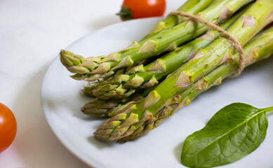 Fresh different vegetables, empty plate