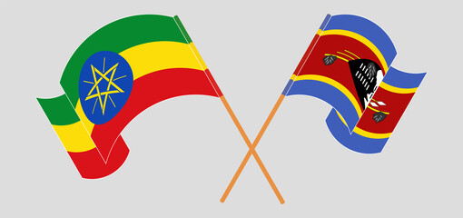Crossed and waving flags of Ethiopia and Eswatini