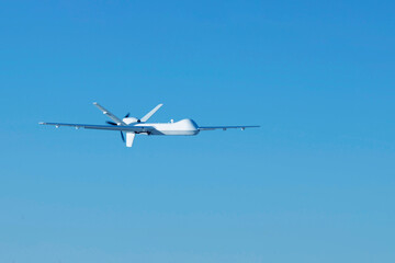 UAV in a cloudless sky. Elements of this image furnished by NASA