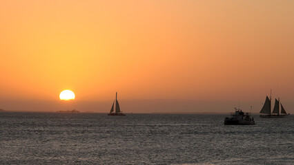 Sailing boats at the coast of Key West on sunset