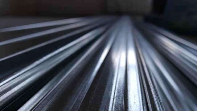 Metal profiles. Stack of stainless steel pipes in warehouse. Rolled metal products. Economic Metals list prices index. Financial crisis. Wall building parts.